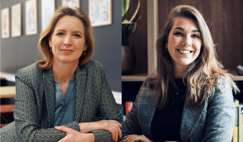 Woman with short blonde hair wearing a patterned blazer and blue blouse smiling at the camera.